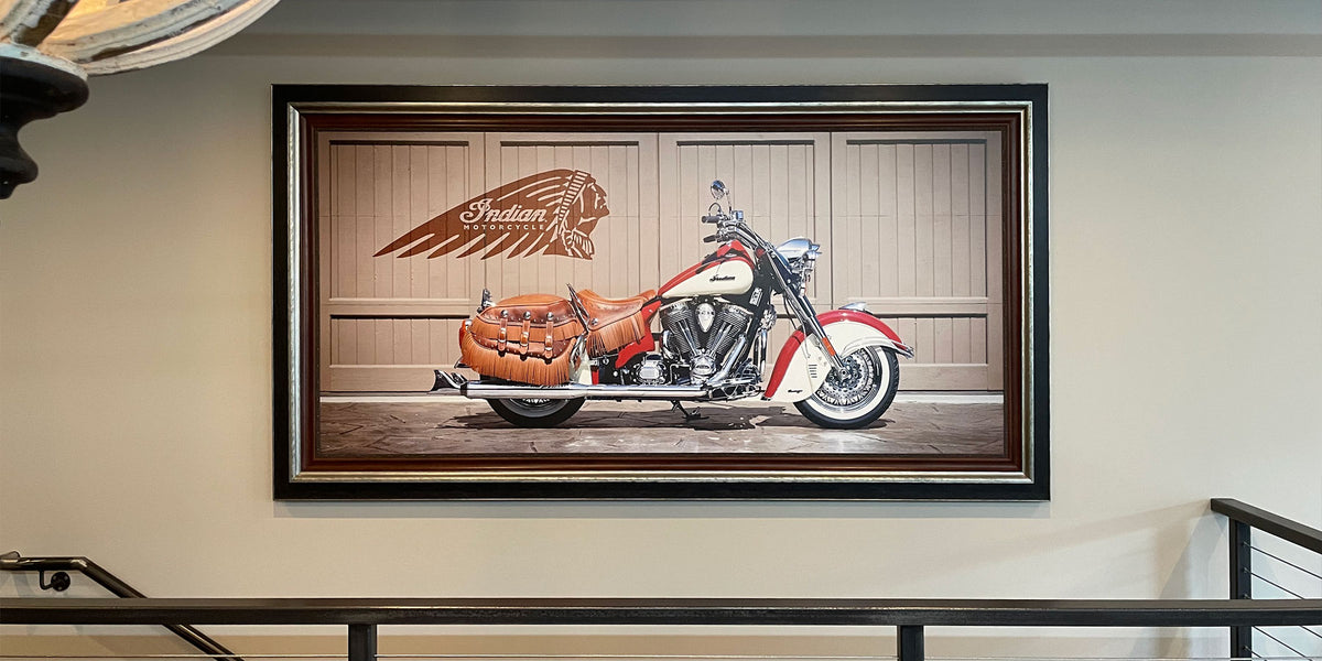 Large custom-framed photograph of a vintage-style Indian motorcycle, featuring a dark wood frame with silver accents.
