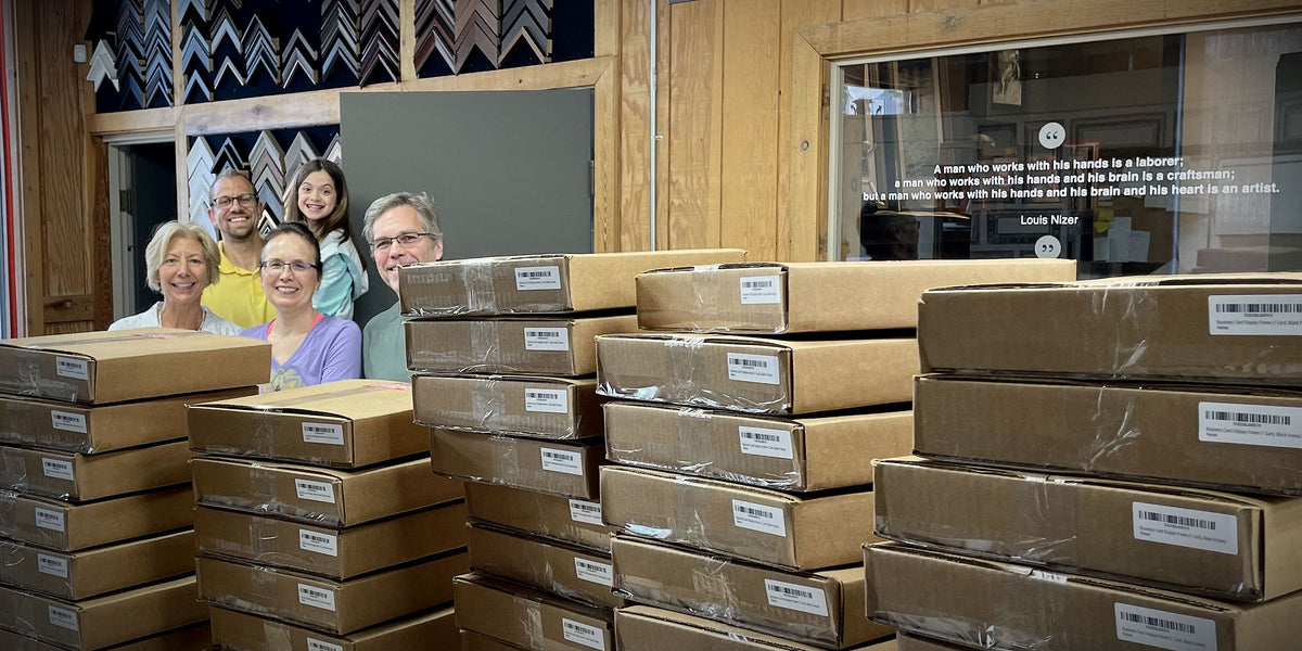 Masterpiece Framing team packaging custom picture frames for nationwide shipping.