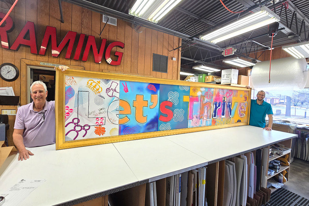 Inside Masterpiece Framing + Imaging workshop showcasing custom framing craftsmanship and large-scale project work.