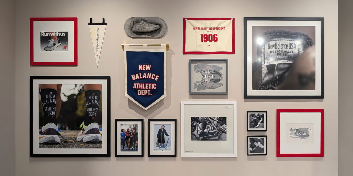 Custom corporate framing installation for New Balance NYC flagship featuring branded photography and dimensional wall displays.