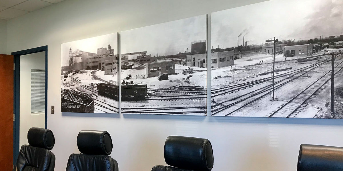 Black-and-white archival industrial photographs framed and installed in a corporate conference room for USG Corporation.